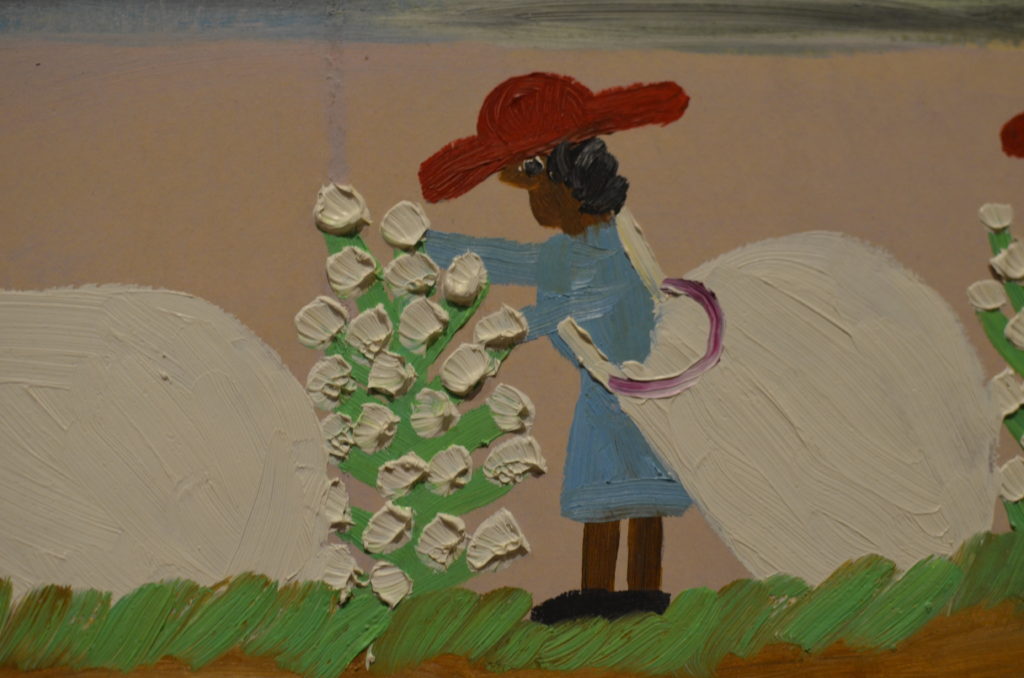Slave harvesting cotton